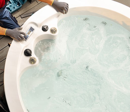 Technician Checking The Water Flow In A Hot Tub